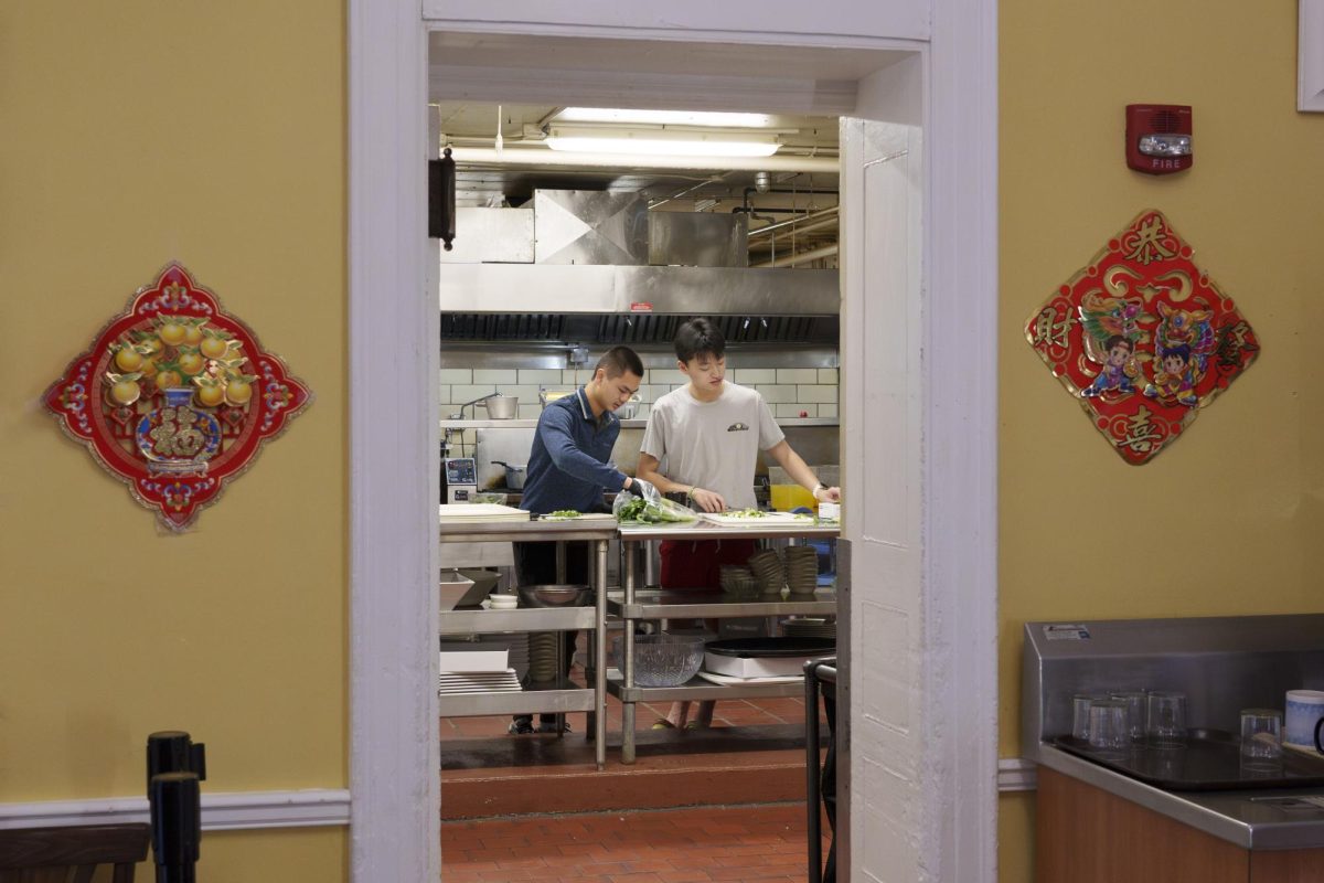 Students preparing for the lunar new year dinner in the kitchen, Saturday, Feb 10, 2024.