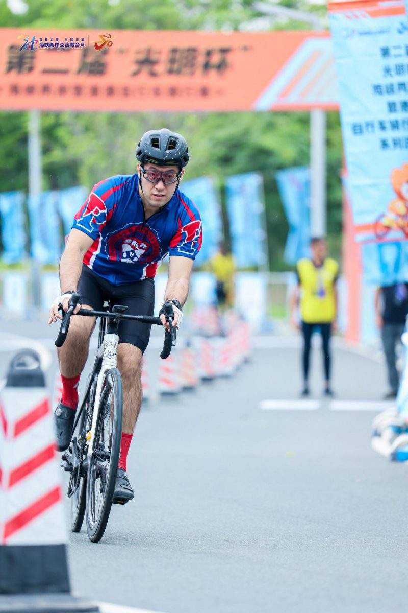 Francis Miller '09 competing in a cycling race.